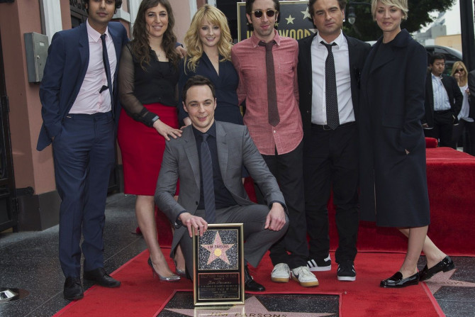 Actor Jim Parsons (crouching) poses with co-stars from the television series "The Big Bang Theory" (from L-R) Kunal Nayyar, Mayim Bialik, Melissa Rauch, Simon Helberg, Johnny Galecki and Kaley Cuoco-Sweeting