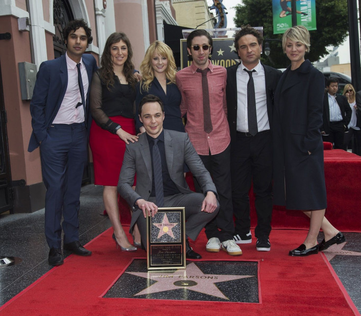 Actor Jim Parsons (crouching) poses with co-stars from the television series "The Big Bang Theory" (from L-R) Kunal Nayyar, Mayim Bialik, Melissa Rauch, Simon Helberg, Johnny Galecki and Kaley Cuoco-Sweeting