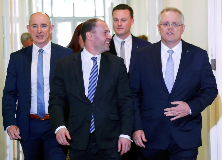 Incoming Australian Prime Minister Scott Morrison (R) walks next to his new deputy Josh Frydenberg