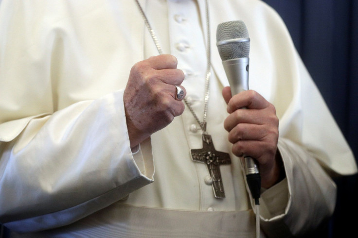 Pope Francis speaks with the media onboard a plane during his flight back from a trip in Dublin, Ireland August 26, 2018.