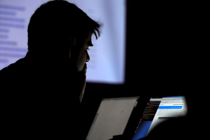 FILE PHOTO: A man takes part in a hacking contest during the Def Con hacker convention in Las Vegas, Nevada, U.S. on July 29, 2017.