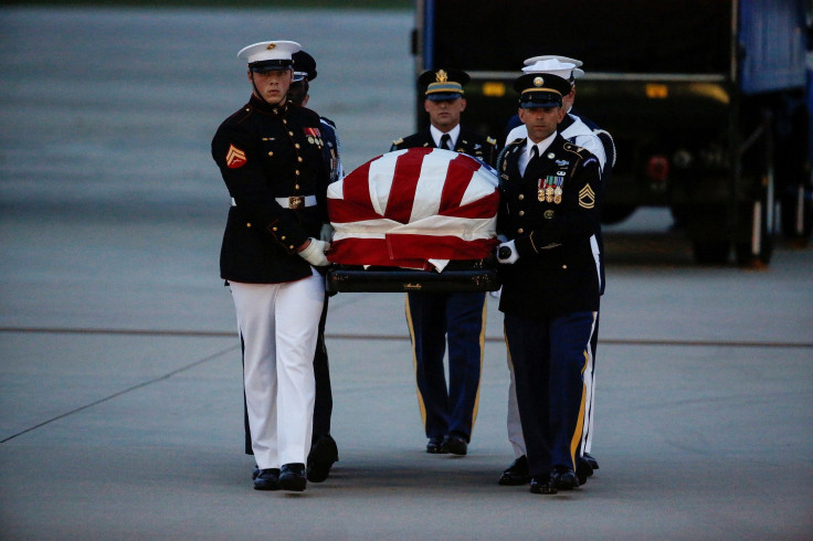 The casket containing the remains of Senator John McCain (R-AZ) is carried by honor guards at Joint Base Andrews in Maryland, U.S., August 30, 2018. 