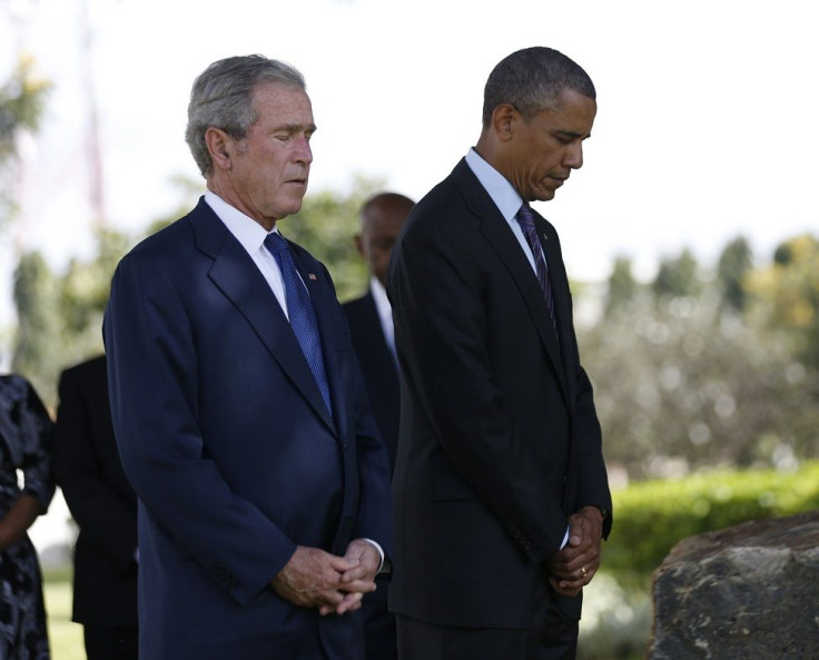 U.S. President Barack Obama and former President George W. Bush (R)