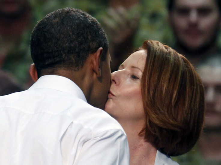 Australian Prime Minister Julia Gillard kisses U.S. President Barack Obama