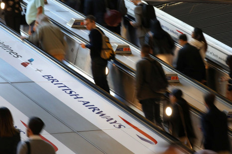 Commuters pass a British Airways advert on the tube at Canary Wharf station in London, Britain September 7, 2018.