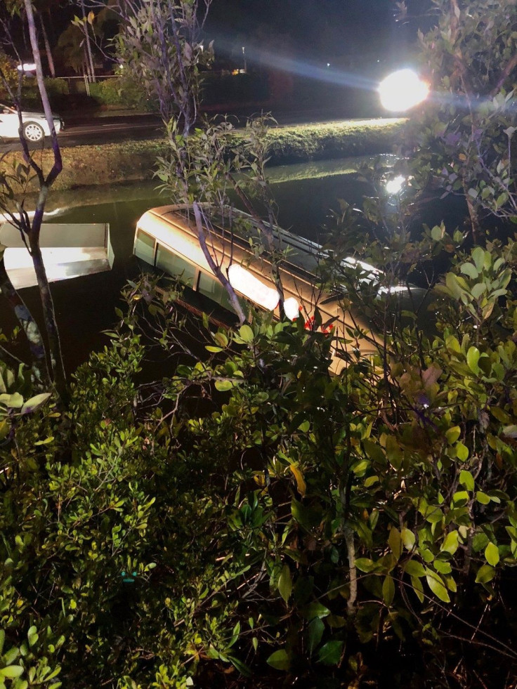 Queensland police dragged a bus driver to safety from a sinking tourist bus in a crocodile-infested creek on Sunday, Sep. 23, 2018.