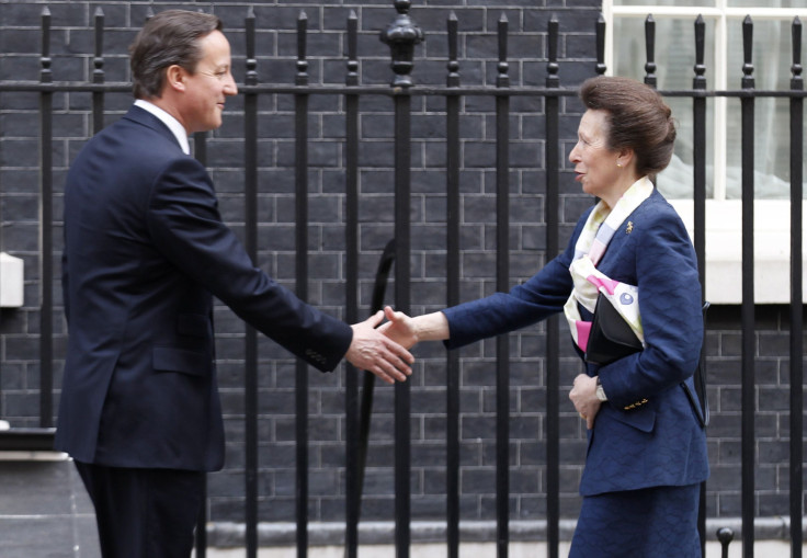 Britain's Prime Minister David Cameron (L) greets Princess Anne outside 10 Downing Street in London March 28, 2012.