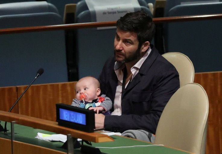 Clarke Gayford, partner to New Zealand Prime Minister Jacinda Ardern, holds their baby Neve