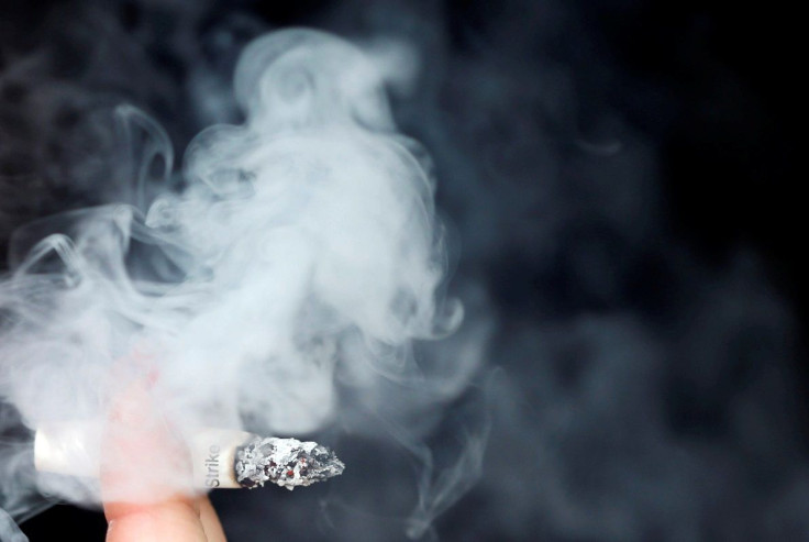 Smoke rises from a burning cigarette in Bordeaux, France, September 19, 2017.