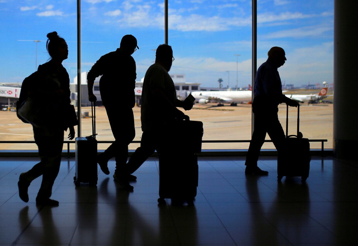 Passengers walk with their luggage towards departure gates at Sydney International Airport in Australia, October 25, 2017. Picture taken October 25, 2017.