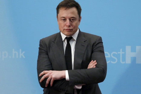 FILE PHOTO: Tesla Chief Executive Elon Musk stands on the podium as he attends a forum on startups in Hong Kong, China January 26, 2016.