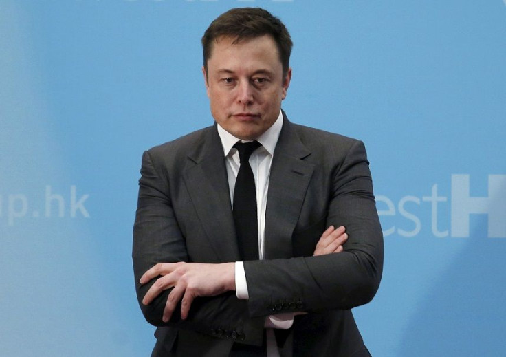 FILE PHOTO: Tesla Chief Executive Elon Musk stands on the podium as he attends a forum on startups in Hong Kong, China January 26, 2016.