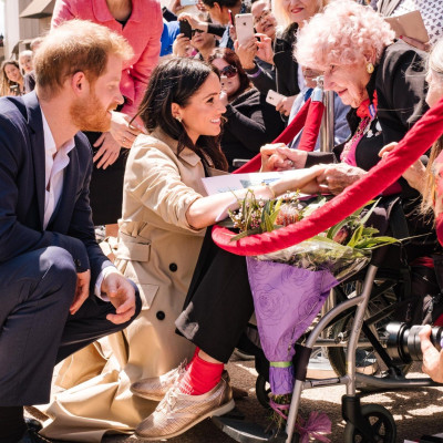 Prince Harry introduces Meghan Markle to Daphne Dunne in Sydney, Australia, October 16, 2018.