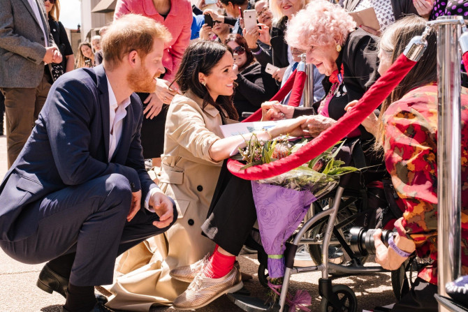 Prince Harry introduces Meghan Markle to Daphne Dunne in Sydney, Australia, October 16, 2018.