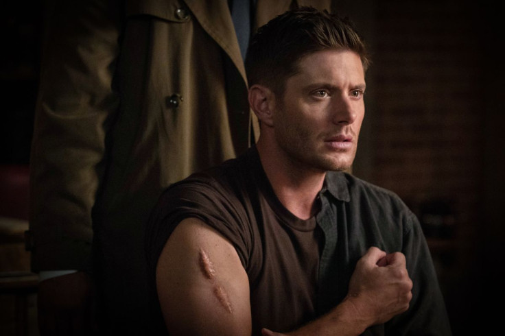 Dean Winchester (Jensen Ackles) shows his scar in "Supernatural" 14x03 "The Scar"