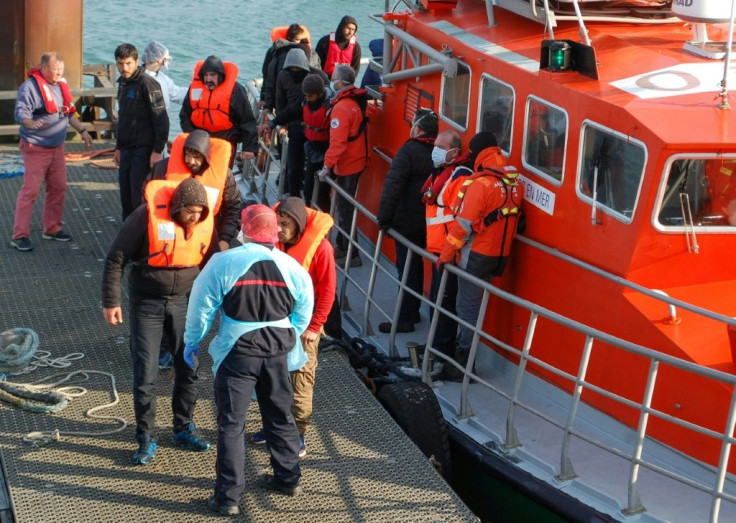 Migrants disembark from a life boat after being rescued off the coast of Calais. The coronavirus pandemic has seen more attempt the crossing, with fewer trucks going through the Channel Tunnel