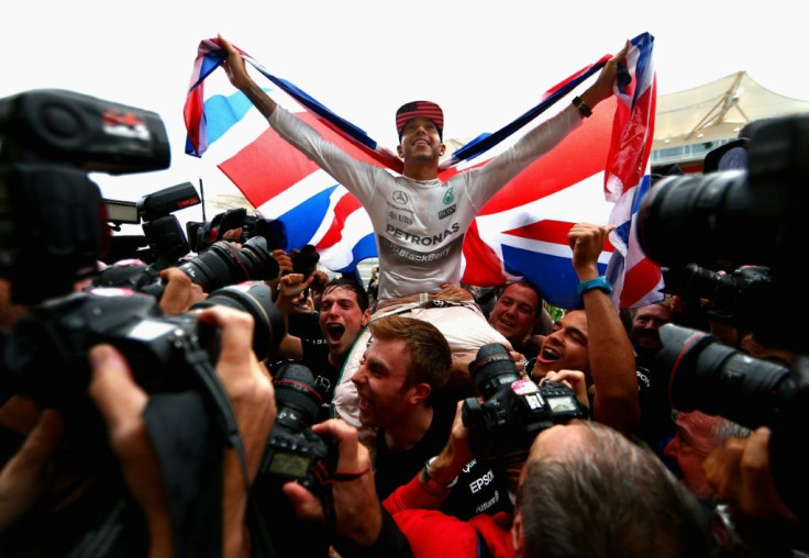 Champion: Lewis Hamilton celebrates at the United States Grand Prix in Texas last season
