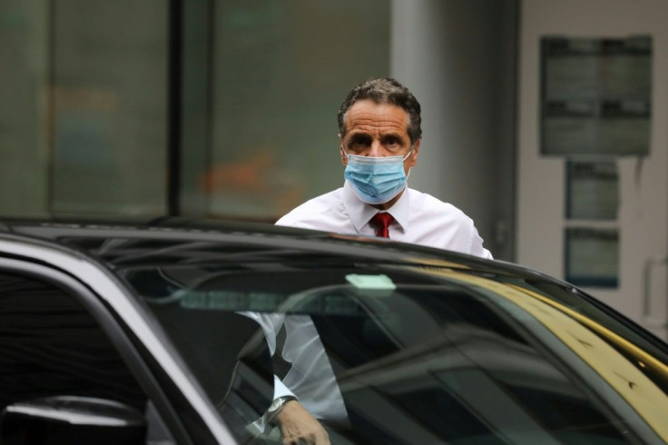 New York Governor Andrew Cuomo arrives at the New York Stock Exchange (NYSE) on the first day that traders are allowed back onto the historic floor of the exchange