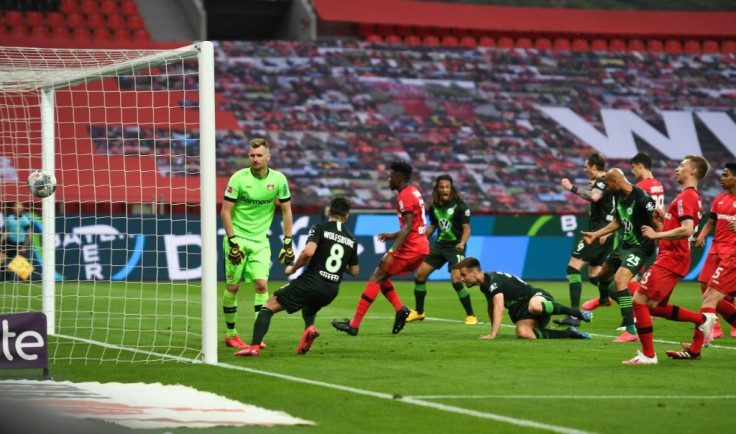 Wolfsburg's Croatia defender Marin Pongracic (bottom centre) scores against Leverkusen.