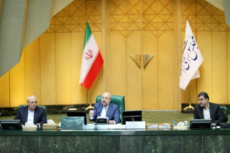 Iranian Parliament speaker Mohammad-Bagher Ghalibaf (C) chairing a parliament session in the capital Tehran