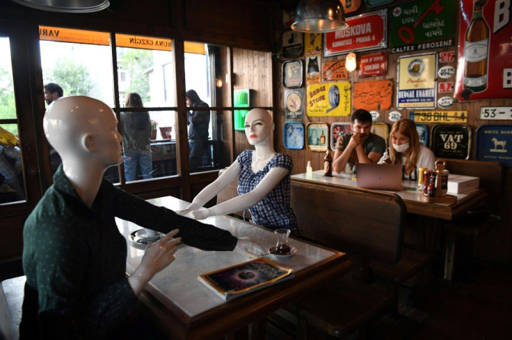 In one cafe near Istanbul's central Taksim square,mannequins set up at the tables encourage social distancing while making the establishment look busier than the rules allow
