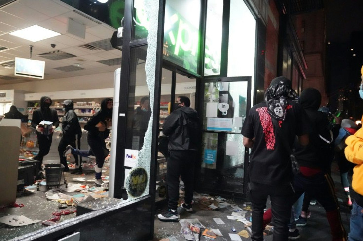 Looters hit stores in New York where the mayor has imposed an overnight curfew