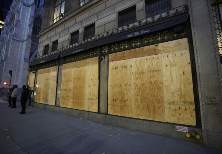 Saks on Fifth Avenue was boarded up after a night of looting in New York city