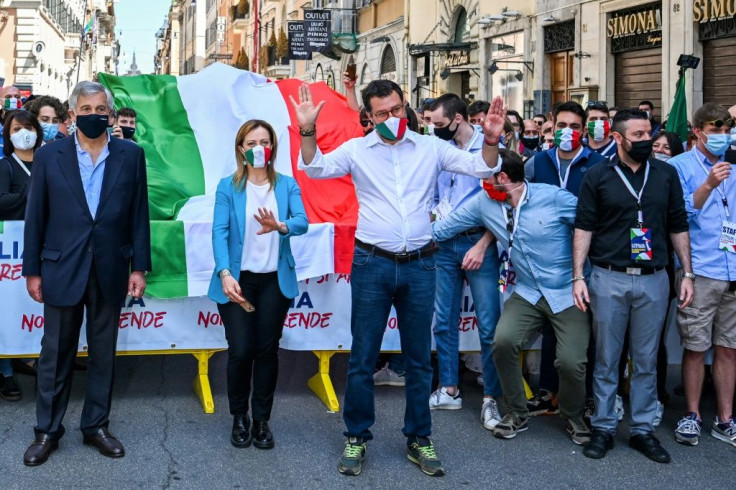 League party chief Matteo Salvini, centre, along with opposition leaders Giorgia Meloni and Antonio Tajani march in protest against the government