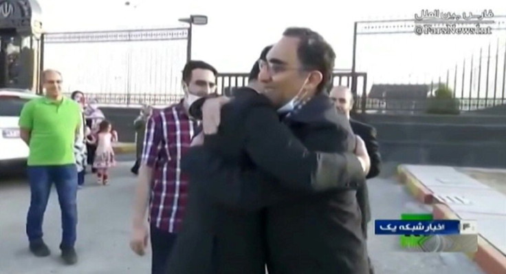 Iranian scientist Cyrus Asgari returns to Tehran in footage from state broadcaster IRIB