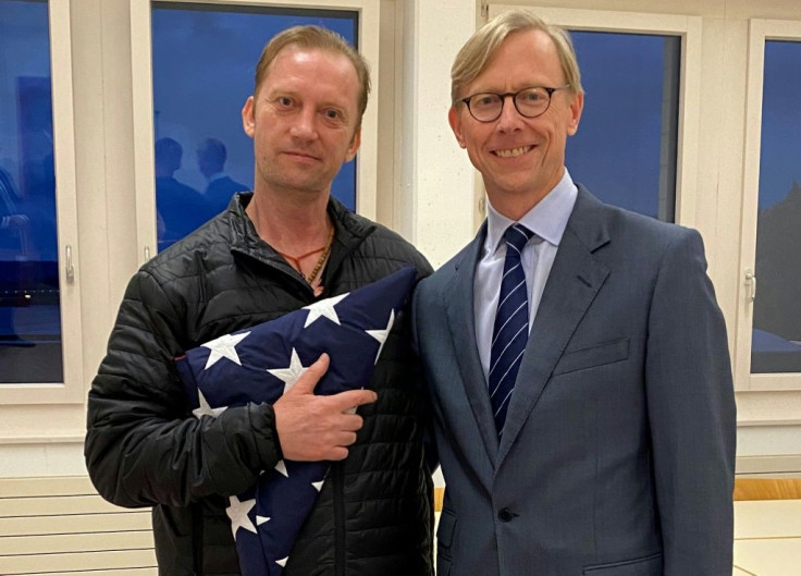 US Navy veteran Michael White poses with US Special Envoy to Iran Brian Hook at the airport in Zurich, Switzerland after White was released from Iran