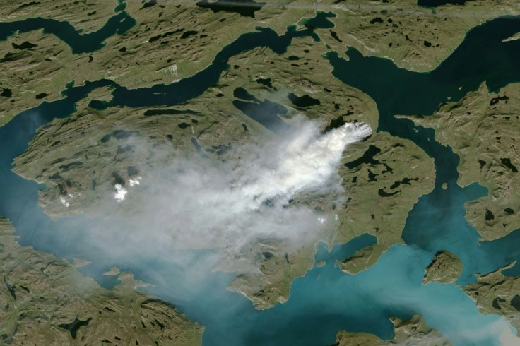 The risk of wildfires increases with warm, dry conditions(NOAA satellite photo showing cloud of smoke from wildfire in western Greenland)