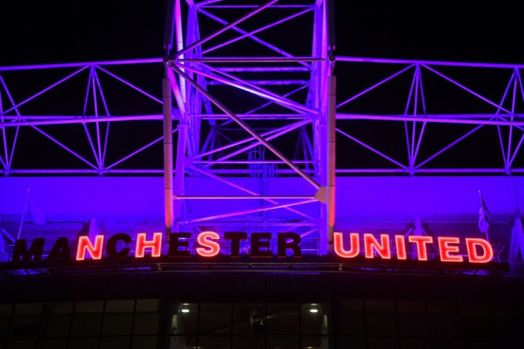 Lights at Manchester United's Old Trafford stadium pay tribute to Britain's National Health Service (NHS)