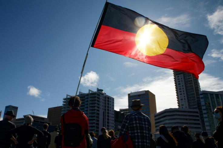 Many protestors carried signs reflecting the Aboriginal experience