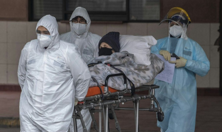 Capital city Santiago now has the fourth-largest number of confirmed cases of any city in the world; pictured are health staff transferring a patient with symptoms of COVID-19 at San Jose Hospital in Santiago amid the novel coronavirus pandemic