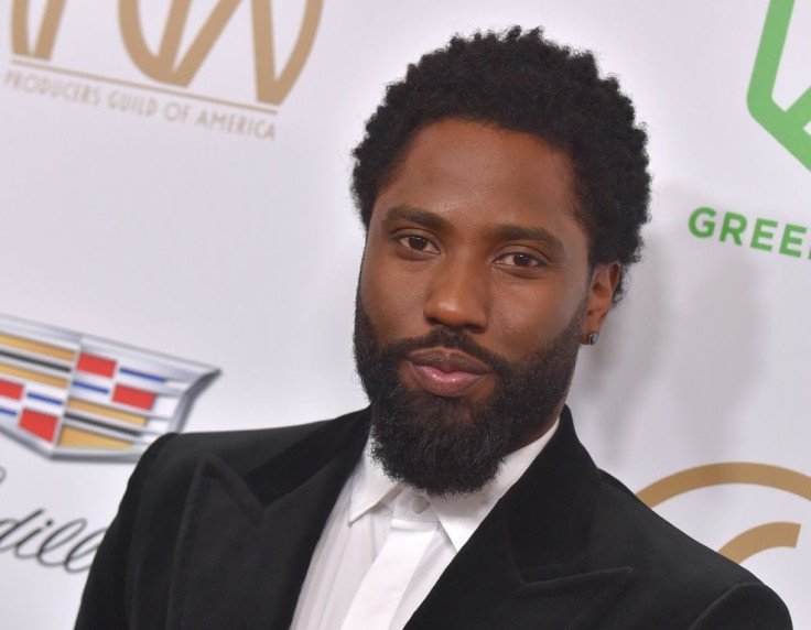 John David Washington, son of Hollywood star Denzel Washington, stars in 'Tenet,' the new Christopher Nolan blockbuster whose release has been delayed again due to the coronavirus pandemic