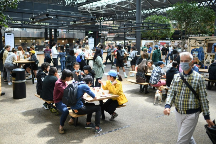 People visit Old Spitalfields Market in London as Britian's Prime Minister Boris Johnson pledges to spend billions on infrastructure to revive the economy