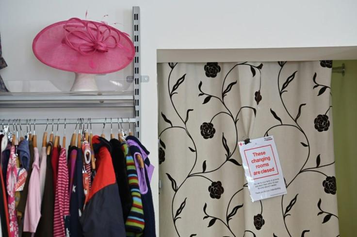 A sign indicates that the changing rooms are closed as a measure against the spread of COVID-19 at a British Red Cross charity shop in London