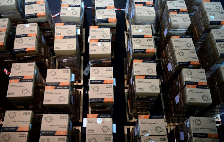 Boxes with protective masks from China -- which has exerted growing influence during the COVID-19 crisis -- are seen at a state camp in Dusseldorf, Germany, in June 2020