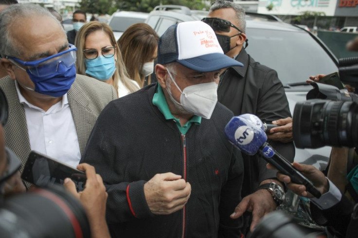 Former Panama president Ricardo Martinelli is surrounded by reporters as he arrives at the prosecutor's office in Panama City