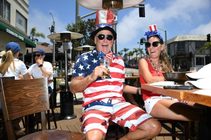Dave Barnes enjoys lunch with his wife Christy Barnes at an outdoor restaurant in Manhattan Beach, California where beaches are closed due to a spike in COVID-19 cases