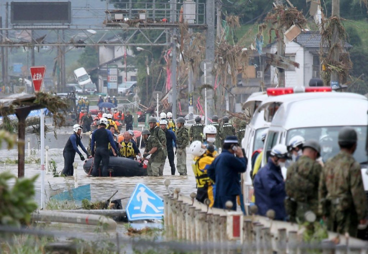 Rescuers are searching for 14 people missing after floods hit the Kumamoto region on Japan's southwestern island of Kyushu