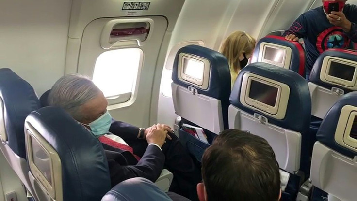 Mexican President Andres Manuel Lopez Obrador wore a face mask on the plane as he traveled to Washington to meet US President Donald Trump
