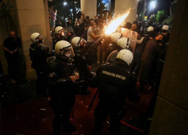 Dozens were hurt, police cars set alight and the parliament building breached in Belgrade's protests