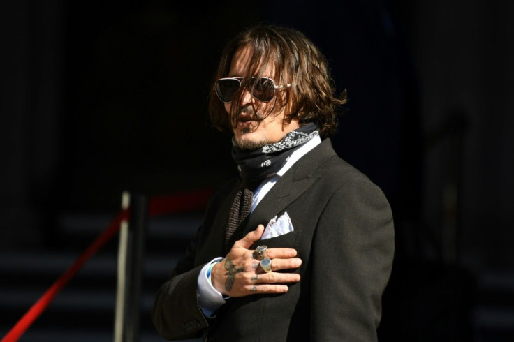 Johnny Depp said the headline in The Sun tabloid altered his Hollywood image and endangered his career