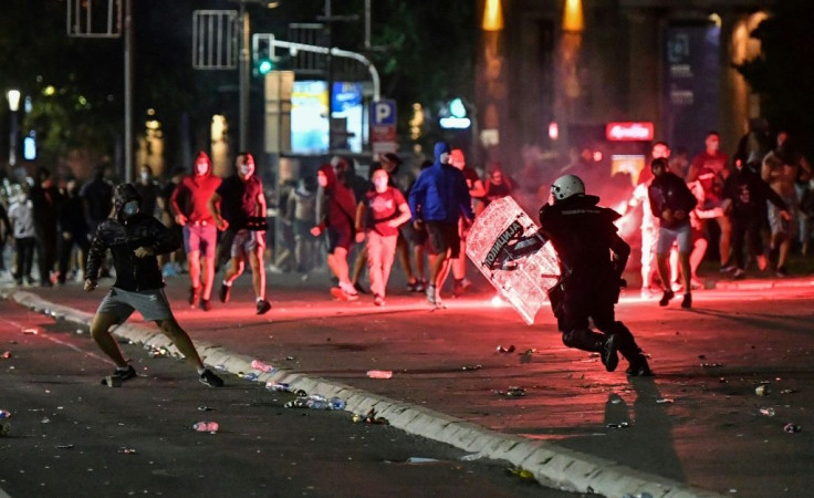 Police clash with protesters near the   National Assembly building in Belgrade, on July 10, 2020, at a demonstration against a weekend curfew announced to combat a resurgence of COVID-19 infections