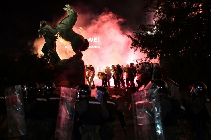 Serbia's government formally dropped the curfew plan and announced restrictions on public gatherings of more than 10 people -- effectively barring protests