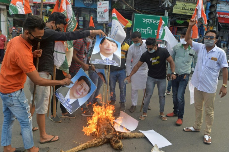 Indian activists burn posters and an effigy of Chinese President Xi Jinping during a June 2020 protest in the eastern city of Siliguri following a deadly border clash
