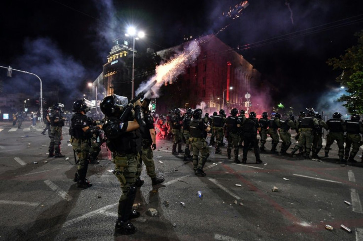 Police fire tear gas in Belgrade on Friday night during the protest against the government's handling of the pandemic