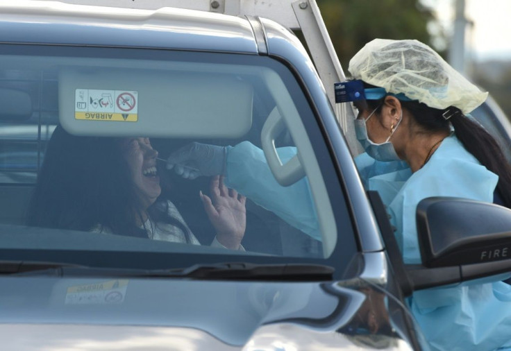 A driver in Sydney gets screened at a pop-up testing centre