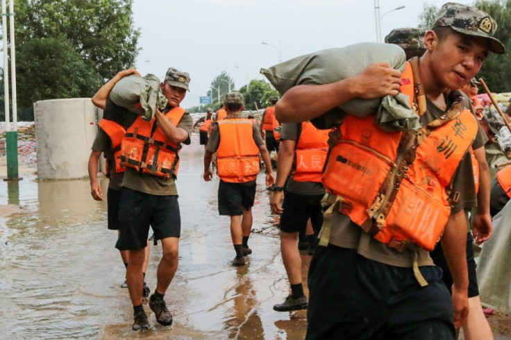 State media reported that more than 100,000 people -- including rescue personnel, soldiers, and ordinary citizens -- had been thrown into flood-control efforts in Jiangxi
